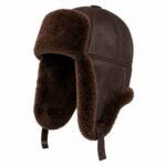 Brown winter trapper hat with fur lining and lowered ear flaps