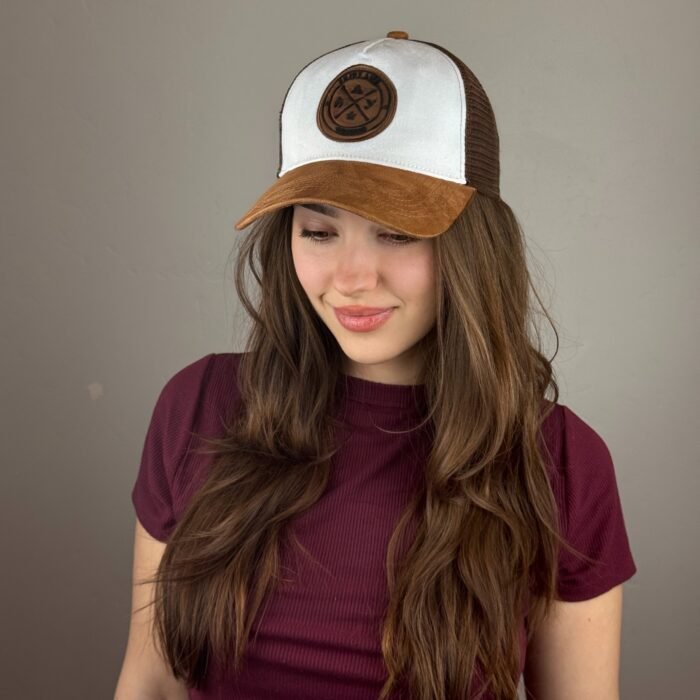 Trucker cap with camel suede brim, white front panel, brown mesh back, and leather Troy Life logo patch