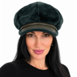 Woman wearing a dark green genuine shearling leather newsboy cap